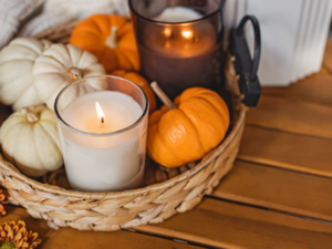 photo of candles and pumpkins in a tray perfect for a spooky reading session