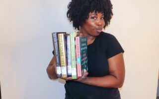 a photo of me kathleen haagenson holding the books featured in my september 2024 reading wrap up