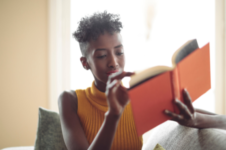 photo of woman reading a book developing a reading habit