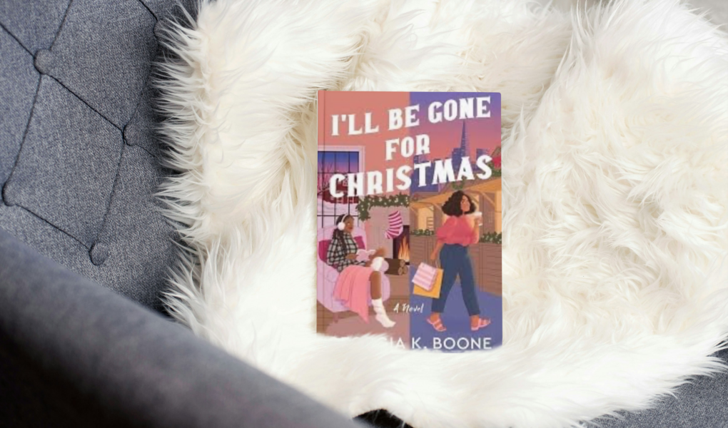 photo of book I'll be gone for christmas by Georgia k. Boone on a couch with a white fluffy throw blanket