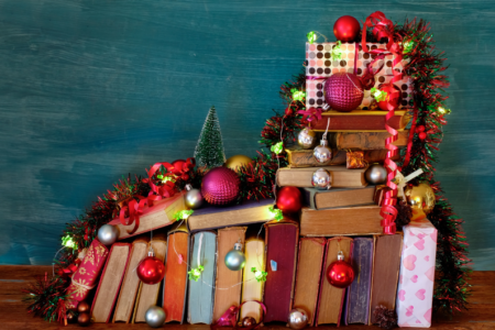 photo of various books with christmas ornaments and decorations for December 2024 book releases