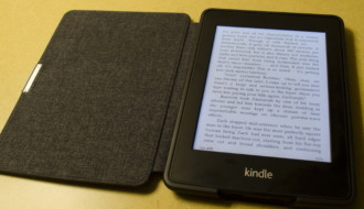 photo of kindle laying on a yellow tabletop for amazon first reads December 2024