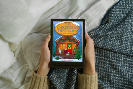 photo of woman holding e-reader with e-book the christmas tree farm by laurie gilmore